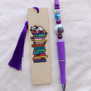 A set of creations for birthday gifts or other gifts. A decorated pen and a wooden bookmark. Handmade gifts at low prices.