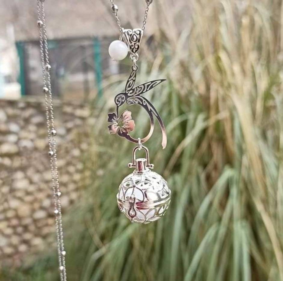 Hummingbird, hibiscus, and moonstone bead pregnancy bola. Fine jewelry. Stainless steel chain.