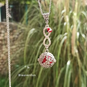 Infinity pregnancy bola and rhinestone ladybug. Stainless steel chain