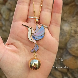 Hummingbird and golden hibiscus pregnancy bola. Fine jewelry. Stainless steel chain