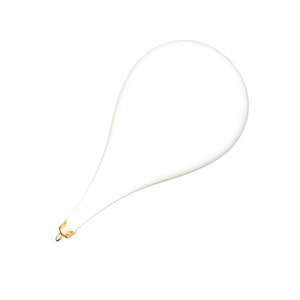 May include: A white teardrop-shaped Christmas bauble with a gold top.