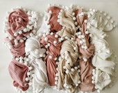 Waffle knit pompom and fringe blankets