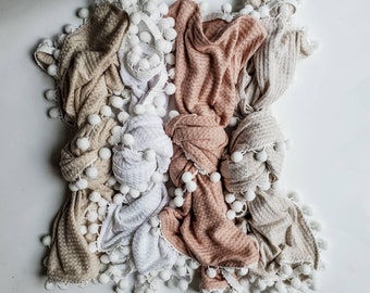 waffle or fringe knit pom pom swaddle blanket