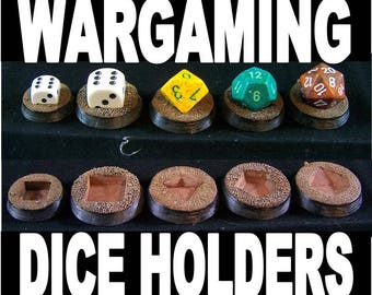 May include: Set of ten brown wooden dice holders with a variety of shapes and sizes. The holders are arranged in two rows of five. The top row features five dice, each in a different color: white, yellow, green, brown, and red. The bottom row features five empty holders.
