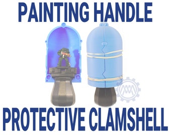 May include: A blue plastic clamshell protective case for painting miniatures. The case has a handle and is open to reveal a miniature figure inside.