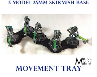 May include: A movement tray for miniature wargaming, featuring five 25mm bases connected in a curved line. The tray is black and has a textured surface. Five silver painted miniature figures with green weapons are placed on the bases. The text "5 MODEL 25MM SKIRMISH BASE" is at the top of the image and "MOVEMENT TRAY" is at the bottom.