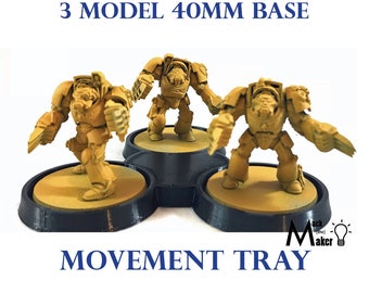 May include: Three yellow painted miniature figures on a black movement tray with a 40mm base. The tray is designed to hold three miniatures for tabletop gaming.