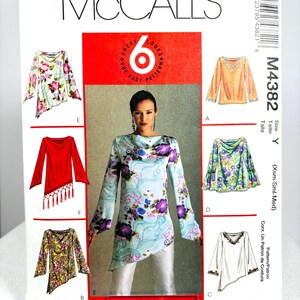 May include: A McCall's M4382 sewing pattern envelope featuring six variations of long-sleeved tops. The cover displays illustrations and a photograph of tops with floral prints, solid colors, fringe details, and asymmetrical hemlines, labeled A through F.