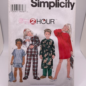 May include: Simplicity sewing pattern number 7407 for children's pajamas. The pattern includes three designs: a red long-sleeved nightgown, a plaid pajama set, and a pajama set with a dog print. The pattern is labeled "2 Hour" and includes sizes BB, 5, 6, 7, and 8.