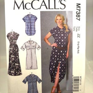 May include: McCall's sewing pattern M7387 featuring various dress and shirt designs. The cover shows a woman wearing a patterned dress with a belt. The pattern includes sizes Lrg-XXL. The McCall's logo is at the top.