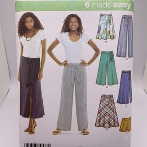 May include: Simplicity sewing pattern number 3793, 6 made easy, for sizes 14, 16, 18, 20, and 22. The pattern includes instructions for making six different styles of skirts and pants, including a long skirt with a side slit, wide-leg pants, a short skirt with a wrap tie, and a pair of wide-leg pants with a wrap tie.