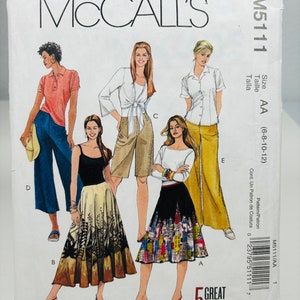 May include: A sewing pattern for five different looks, including a skirt, pants, and a top. The pattern is for sizes 6-8-10-12 and is called McCall's M5111.
