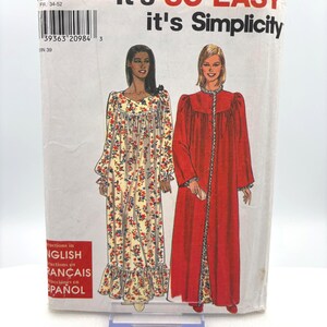 May include: A vintage sewing pattern titled "It's SO EASY it's Simplicity." The pattern features illustrations of two long gowns. One gown is floral, and the other is a solid red color. The pattern includes instructions in English, French, and Spanish.