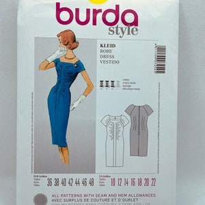 May include: Burda Style sewing pattern number 7254 for a dress. The pattern includes sizes 36 to 48 and 10 to 22. The pattern is for a dress with a fitted bodice and a skirt that falls to the knee. The pattern includes seam and hem allowances.