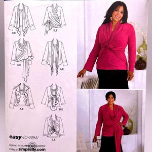 May include: A sewing pattern for a long-sleeved top with a wrap design. The pattern is from Simplicity and is part of the Khaliah Ali Collection. The pattern includes five different views of the top, with variations in the neckline and the way the wrap is tied. The pattern is for sizes 18W-24W (EUR. 44-50, FR. 46-52).