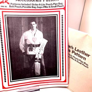 May include: A black and white photo of a man wearing a leather vest and a fringed leather pouch. The image is from a vintage leather accessories pattern booklet. The text on the cover reads "Frontiersman's Leather Accessories Pattern" and lists the patterns included: "Strike-A-Lite Pouch, Pipe Bag, Belt Pouch, Possible Bag, Gage d'Mor & Small Pouch".