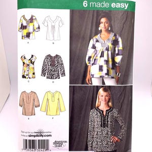 May include: A sewing pattern for a women's blouse with six different variations. The pattern is from Simplicity and is labeled "6 made easy". The pattern includes a variety of necklines, sleeve lengths, and embellishments.