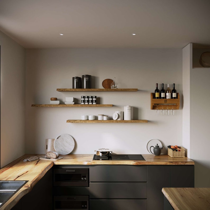 May include: A modern kitchen with dark gray cabinets and a wooden countertop. The kitchen features a wooden wine rack with wine bottles, wooden shelves with various items, and a black stovetop.