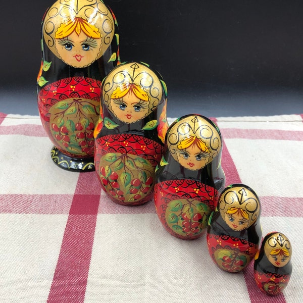 5 Piece set of 1990's Russian Hand Painted Wood Nesting Dolls