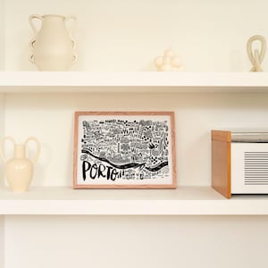 Discover Porto with this chic black-and-white illustrated map by Sira Lobo! Perfect for living room decor, available in various sizes and framing options. Ready to hang and bring a touch of Porto’s charm to your space.