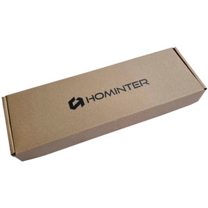 May include: A brown cardboard box with the company logo "HOMINTER" printed in black.