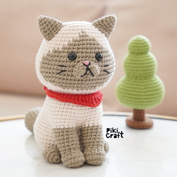 Sushi le motif amigurumi du chat siamois. Modèles de chaton au crochet Amigurumi. Modèles d'Amigurumi au crochet de chat assis mignon.