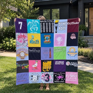 May include: A rectangular memory quilt constructed from twenty-five square fabric panels featuring various graphic prints, including volleyball logos, school emblems, text, and tie-dye patterns in a diverse array of colours like purple, blue, and pink.