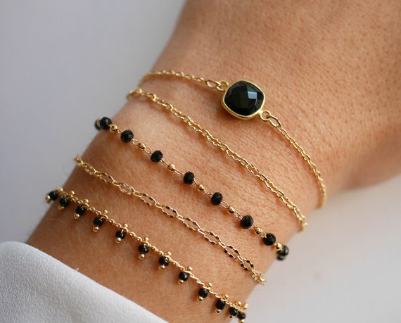 Black stone bracelet in cheap gold