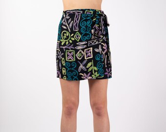 The Puerto Plata Skirt | LIMITED EDITION Handmade 90s Style Wrap Around Tie Up Beach Mini Skirt in Navy, Purple, Green & Cream Batik Print