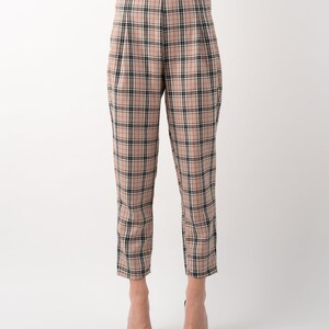 Beige nova check tartan tapered leg trousers front