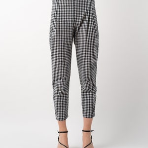 Black and white gingham print tapered leg trousers front