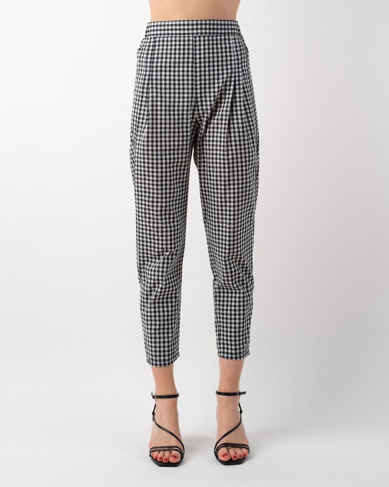 Black and white gingham print tapered leg trousers front