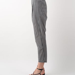 Black and white gingham print tapered leg trousers side