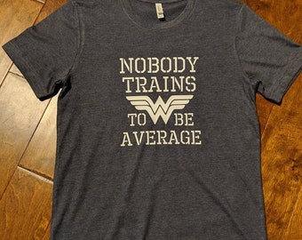 Nobody Trains To Be Average- Unisex Tee