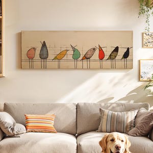May include: A rectangular wall art piece featuring a horizontal line with eight stylised birds in various colours including pink, grey, yellow, green, brown, red, and black, set against a light beige background with thin black grid lines.