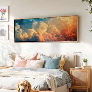 Quadro decorativo minimalista com nuvens ao pôr do sol.