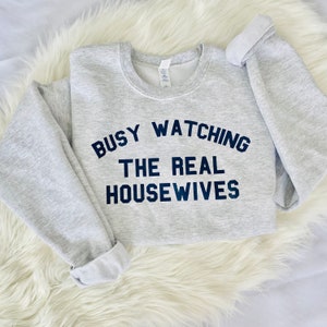 Busy Watching The Real Housewives Vintage Grey Cozy Retro Funny Sweatshirt