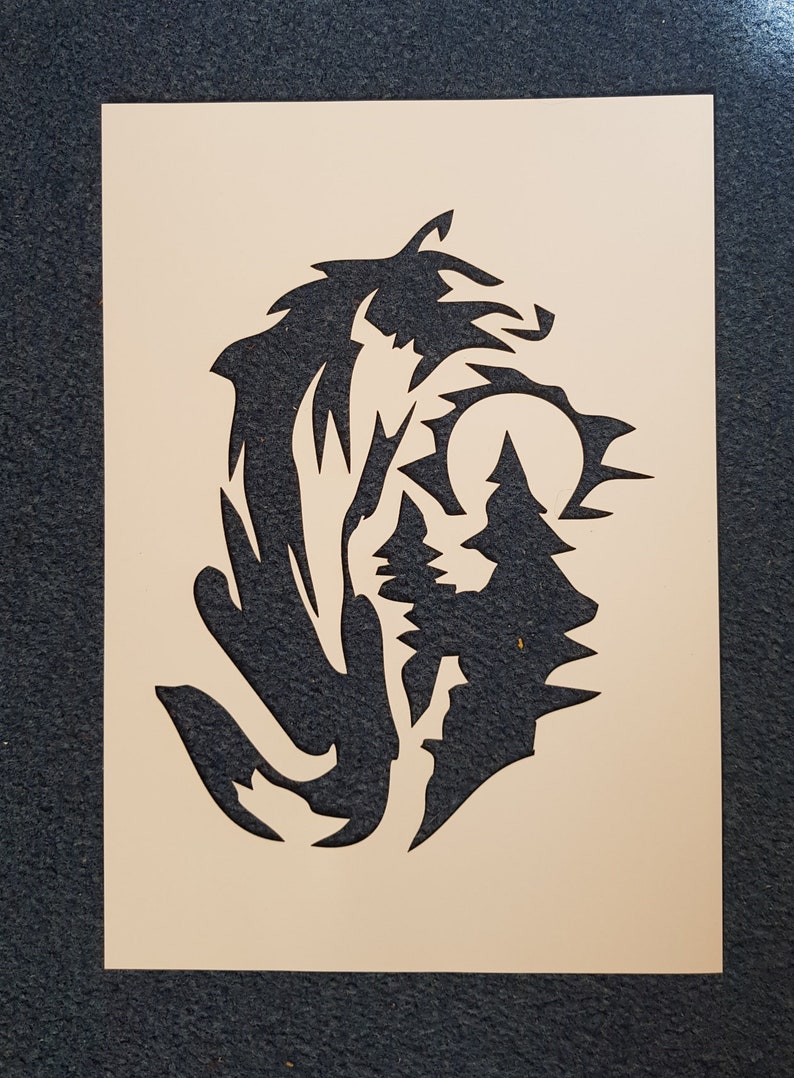 laser cut from mylar Tribal wolf and moon stencil