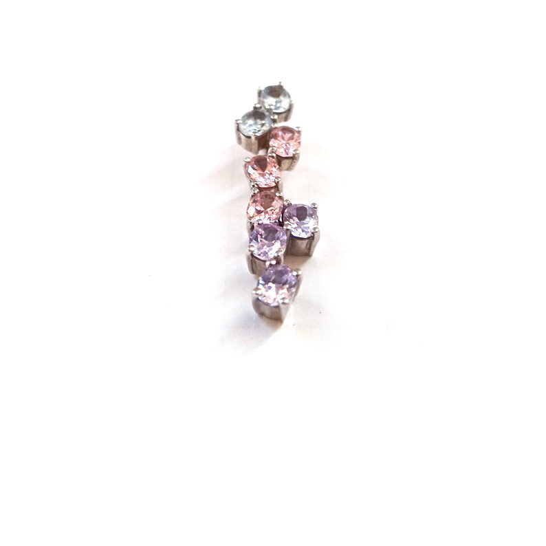 May include: A silver pendant with a gradient of light blue, pink, and purple gemstones.