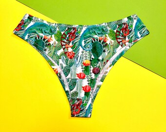 May include: White underwear with a green, red and yellow print of cacti and chameleons.