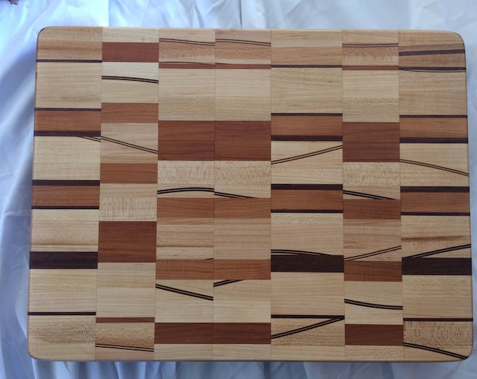 A Contrast of Order and Chaos Cutting Board with Walnut, Maple and Cherry blocks with Curved Through Thickness Inlays