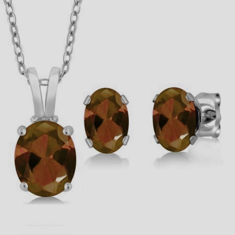 Oval Shaped 1.55 Carat Natural Rhodolite Garnet Set In 925 Sterling Silver Sun Garnet