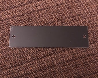 3.825”x1” Black Aluminum Rectangle with nail holes (writing is gold) - Engraved Plate (adhesive backing)