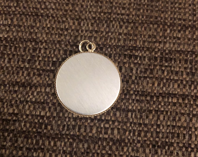 Round pendant charm 1” diameter- silver toned front with gold back