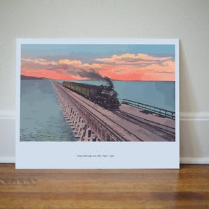 May include: A vintage postcard showing a train crossing a trestle bridge over a body of water at sunset. The train is a steam locomotive with a black engine and green passenger carriages. The sky is a vibrant orange and pink, and the water is a calm blue. The postcard reads "Great Salt Lake Cut Off, Utah - 1919."