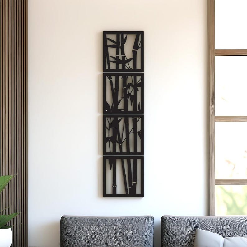 May include: A set of four black bamboo wall art panels. Each panel features a different bamboo stalk design. The panels are rectangular and arranged vertically on a white wall, creating a modern, nature-inspired decor element.
