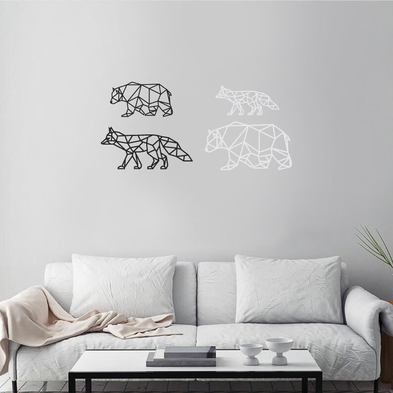 May include: Four geometric wall art pieces featuring animal silhouettes. There is a black bear and a black fox on the left, and a white fox and a white bear on the right. Each animal is constructed from a series of connected straight lines.
