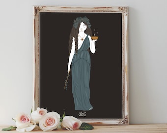 May include: An art print featuring a woman in a teal dress and a laurel wreath, holding a bowl and a branch. The artwork is framed in a distressed white frame, with the name "CIRCE" at the bottom. Soft pink roses are in the foreground.