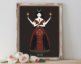 May include: Framed art print featuring a stylized illustration of Hecate, a figure with long black hair, a crescent moon, and a red dress adorned with floral patterns. She holds torches and is flanked by two black dogs. The word "HECATE" is at the bottom.