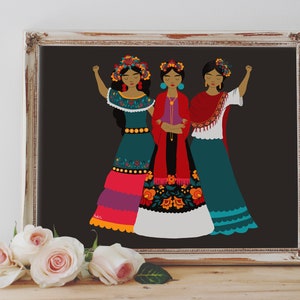 May include: Three women wearing traditional Mexican dresses with floral embroidery and colorful accents. They are standing together with their fists raised in the air. The background is a dark gray.